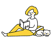 読書をしてくつろぐ女性と猫